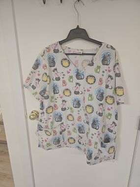 Scrubstar White V-Neck Women's Scrub Top with Multicolor Animal Medallions